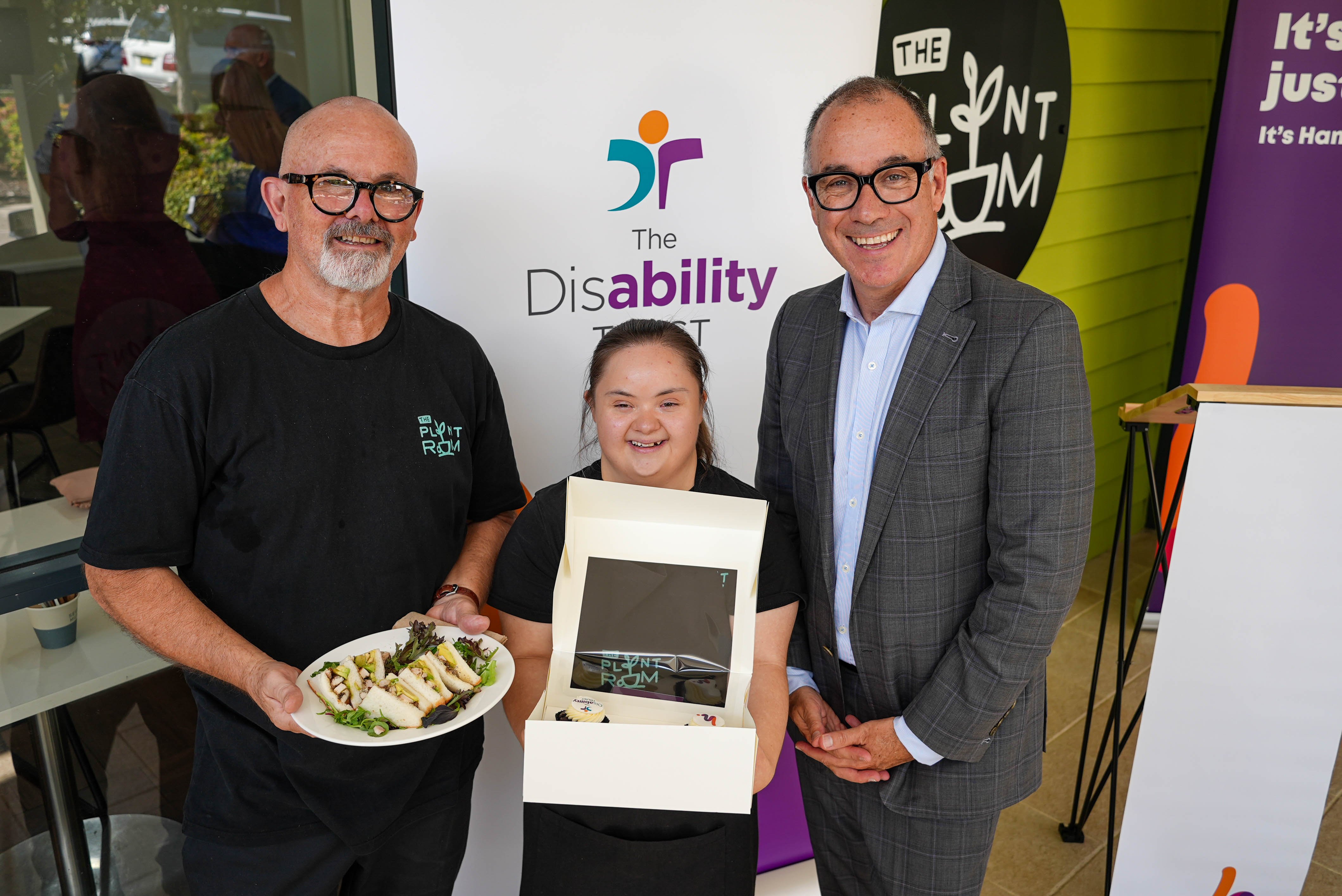 Andrew Thorburn (right) with cafe employee Emily Green and chef Lorenzo Pagnan