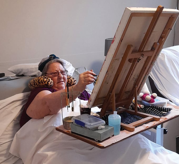 Sandra painting in bed 2