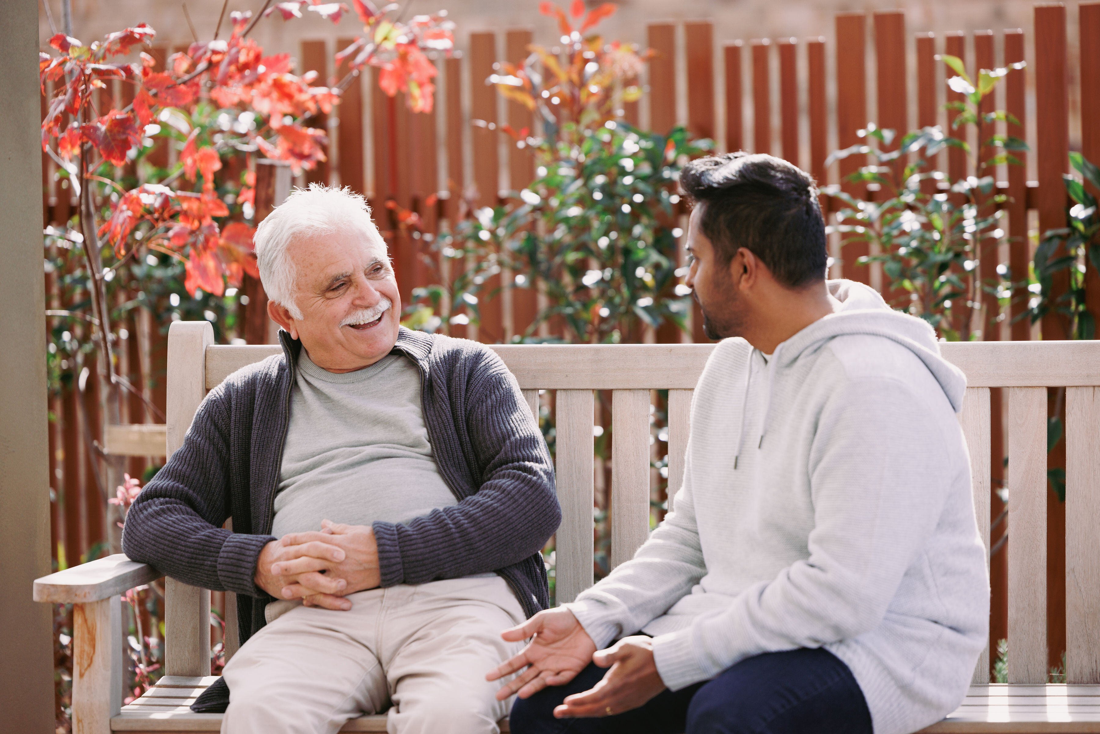 A woman and a carer prepare a meal at HammondCare Cardiff, an aged care home in Cardiff, NSW.